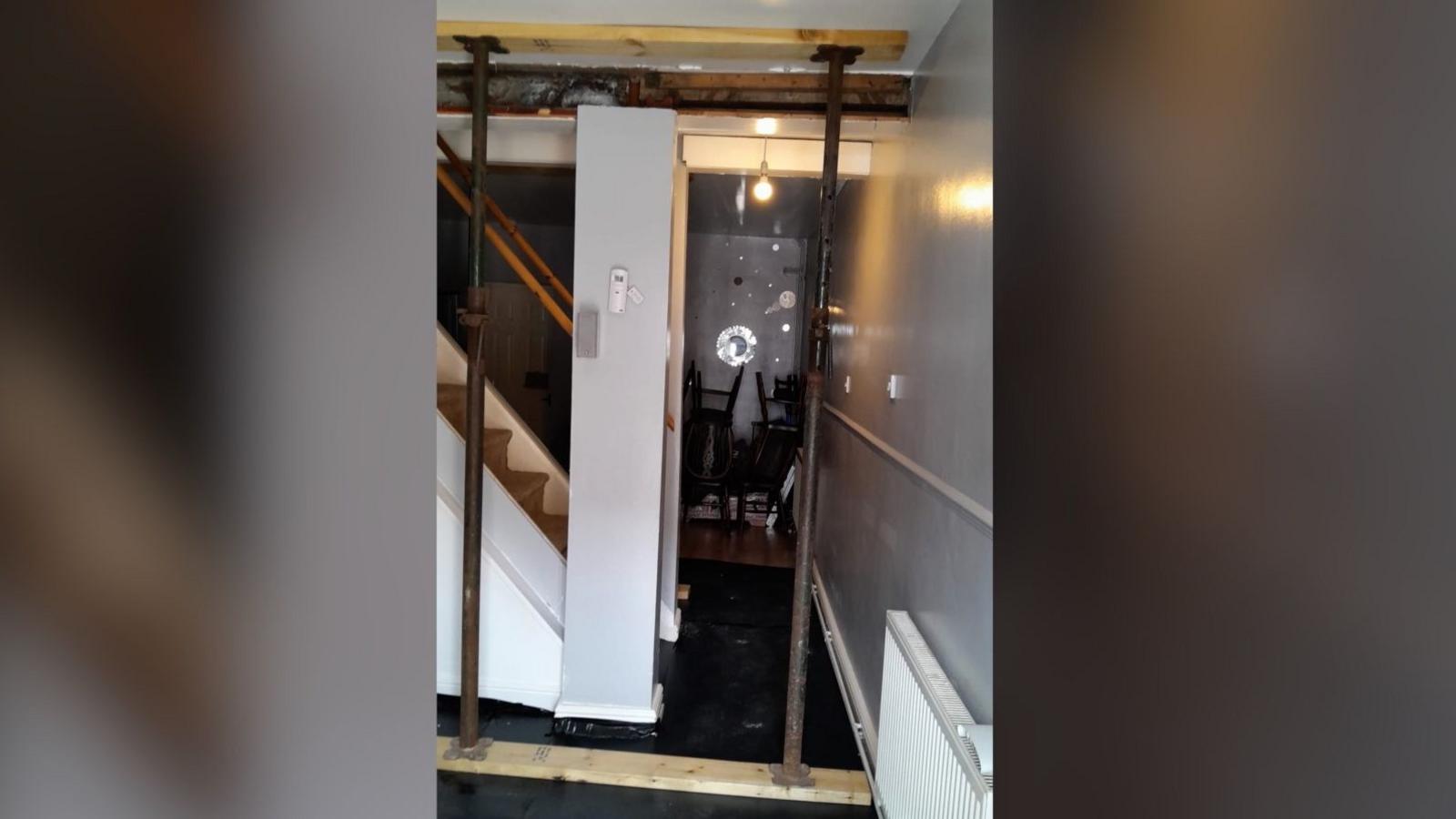 Steel uprights fixed to the ground floor and the ceiling in the downstairs of the property
