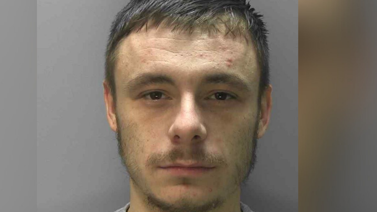 A mugshot of Kyle Dumble, who has been convicted of murder, attempted grievous bodily harm with intent and driving while disqualified and without insurance. He has a short beard and brown hair.