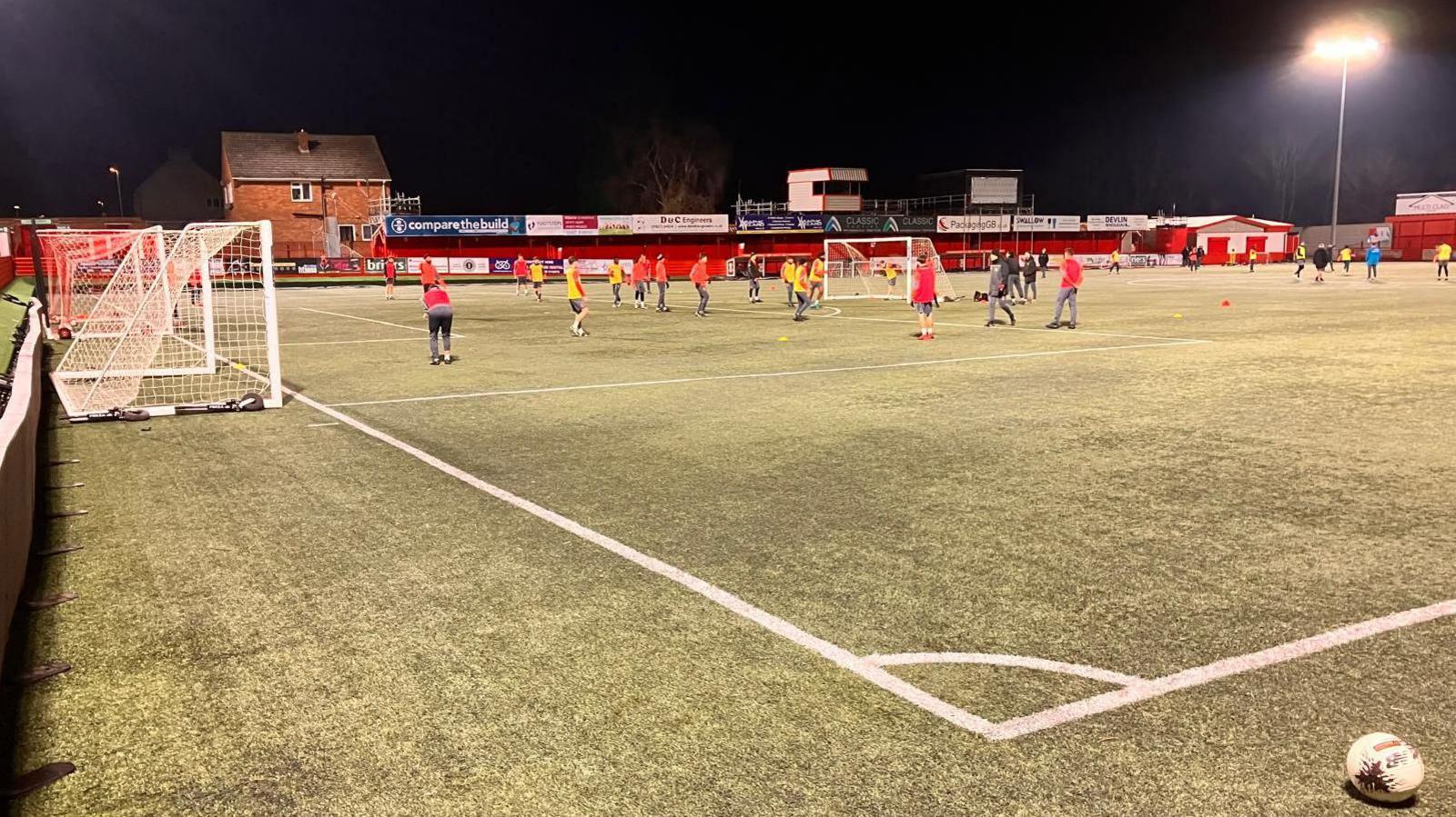 Tamworth's players train in sub-zero temperatures at the frozen Lamb on Thursday night