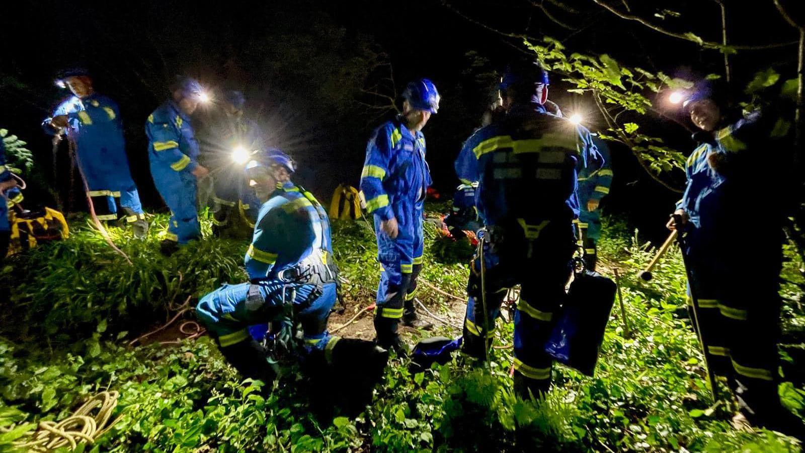 Emergency service personnel preparing to rescue six people