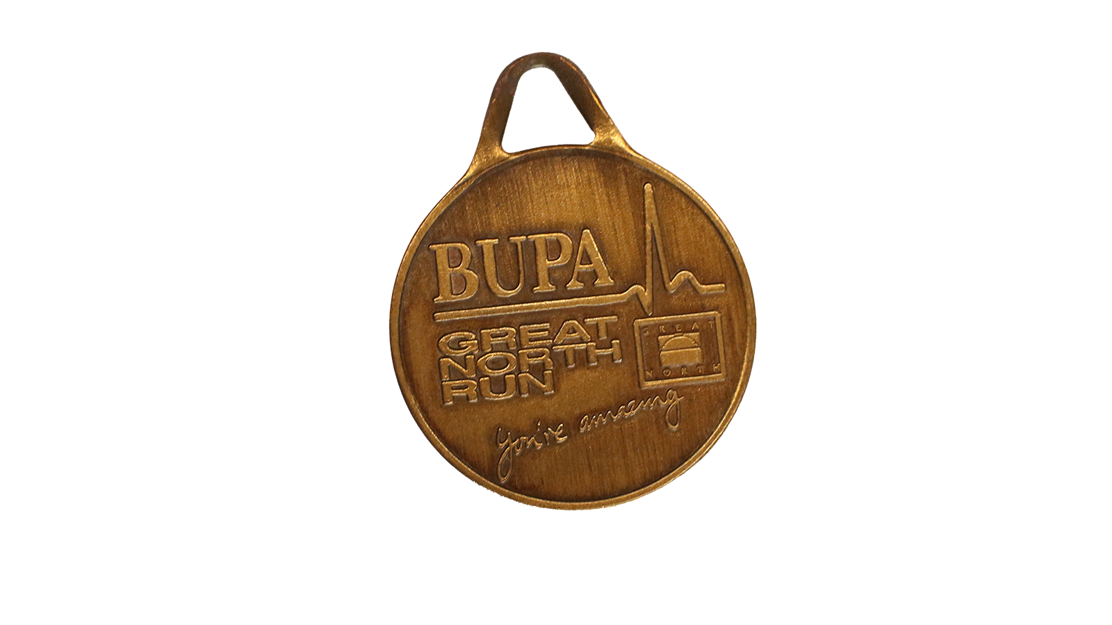 A bronze coloured circular medal that reads 'Bupa' and has a heartbeat line underneath and wording which reads 'Great North Run' 'you're amazing'. 