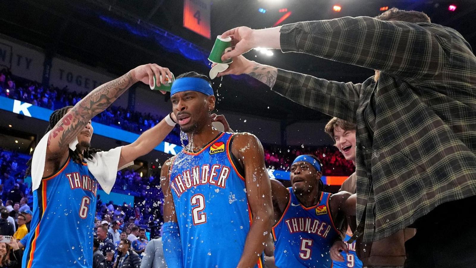Shai Gilgeous-Alexander, of the Oklahoma City Thunder, gets drinks poured on him after the win against the Boston Celtics