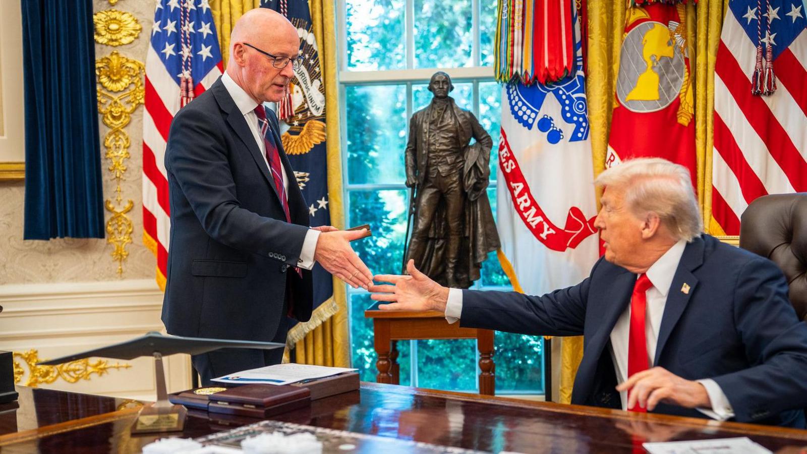 John Swinney and Donald Trump shake hands in the Oval Office
