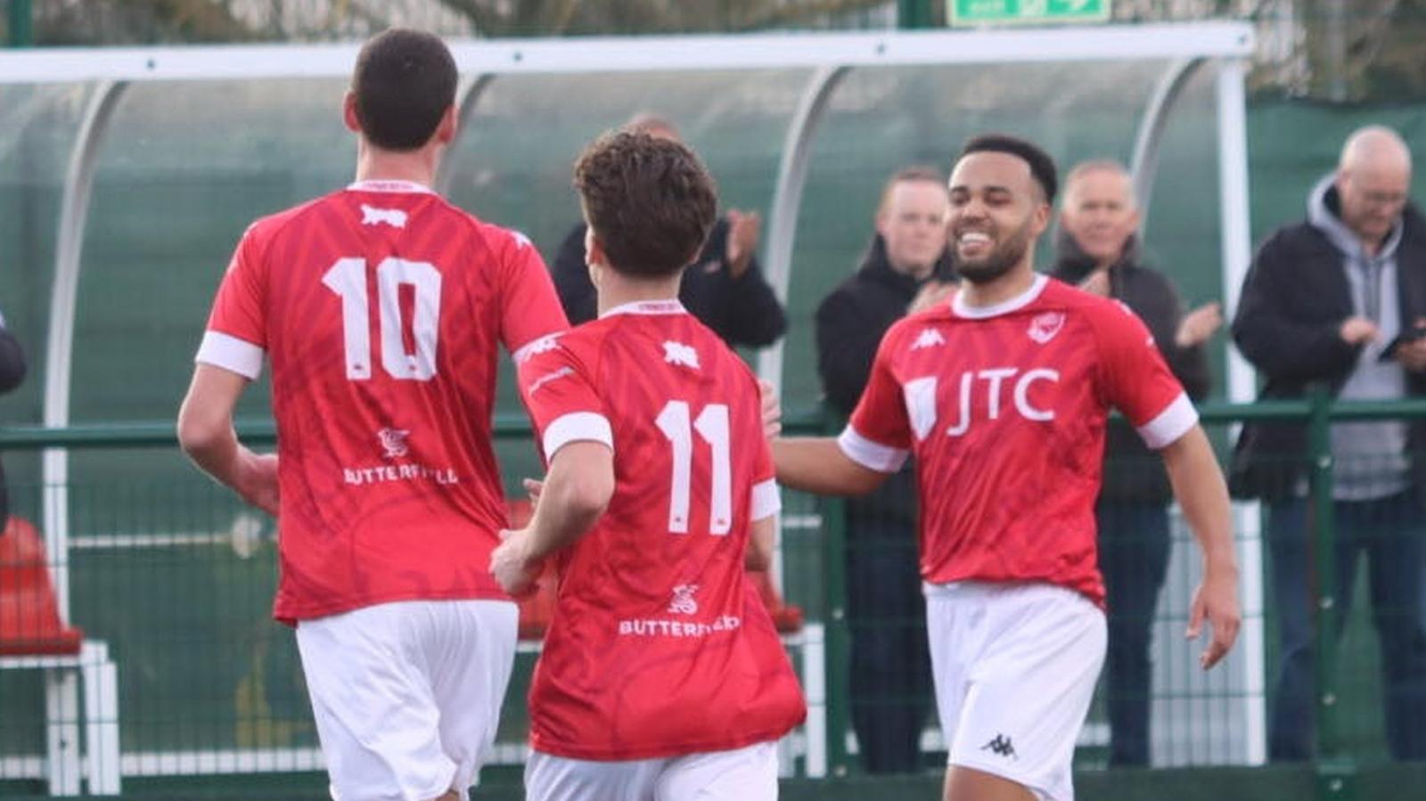 Jersey Bulls celebrate their second goal against Guildford City