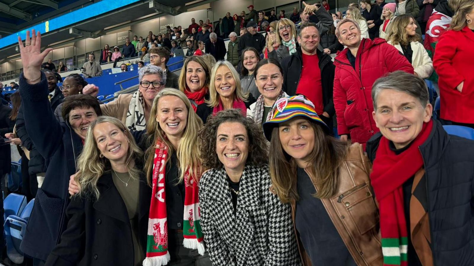 A group of women at a Wales football match. 