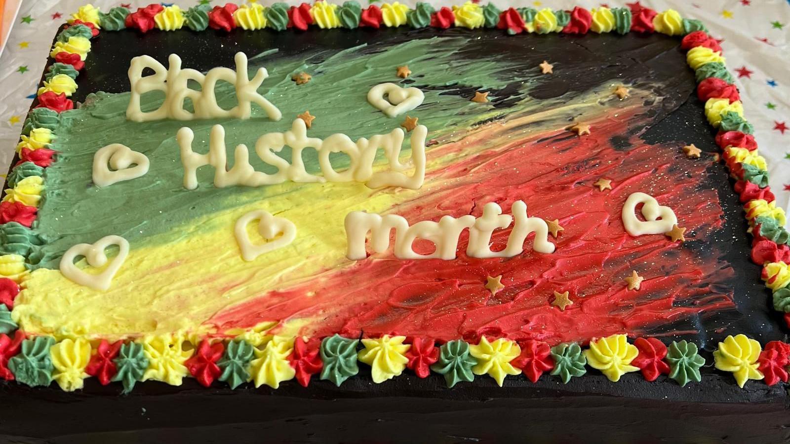 A cake with Black History Month in icing on the top