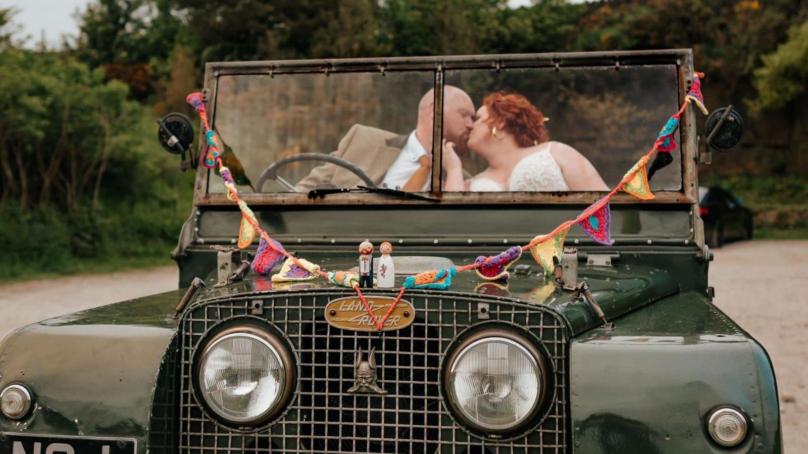 Rachael and Luke in their wedding car