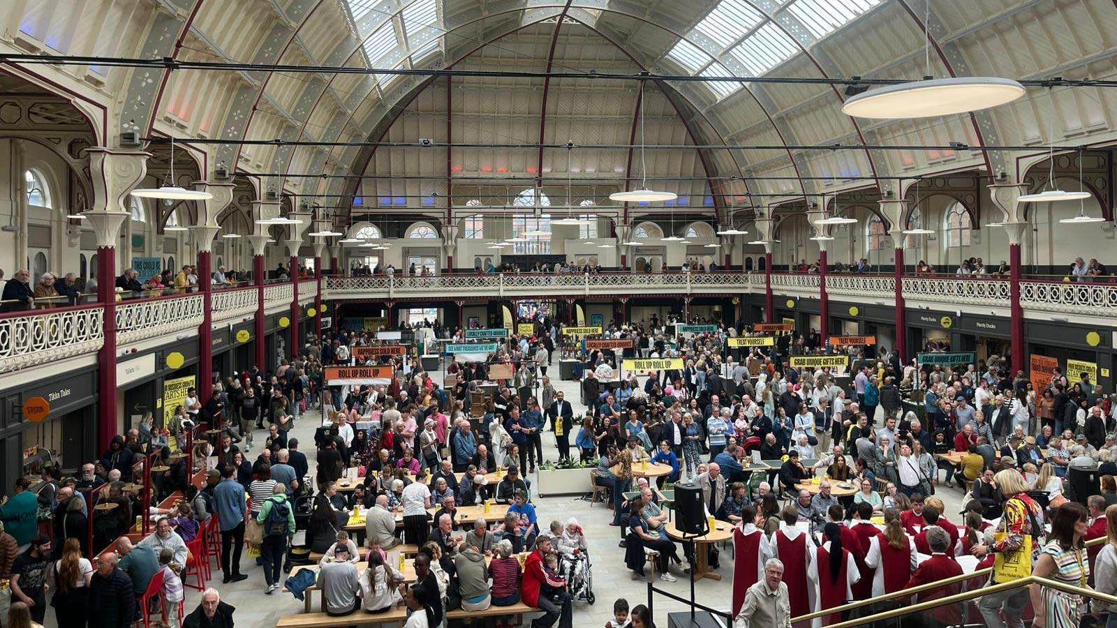 Large crowds inside a newly-refurbished Derby's Market Hall taken from the top terrace. 