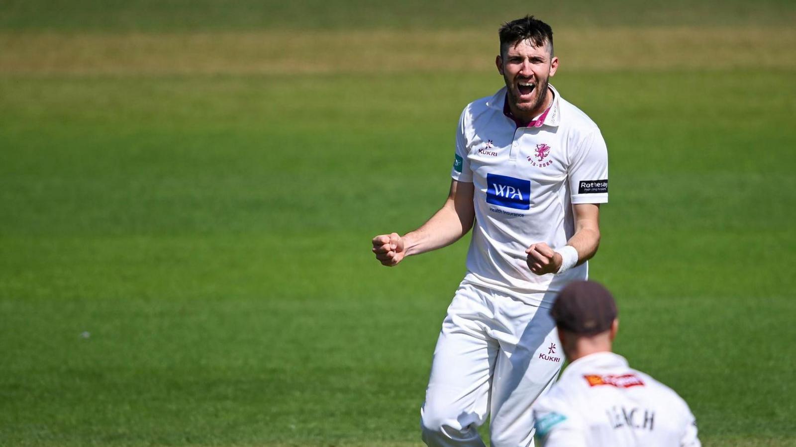 Somerset's Craig Overton celebrates taking a wicket against Sussex