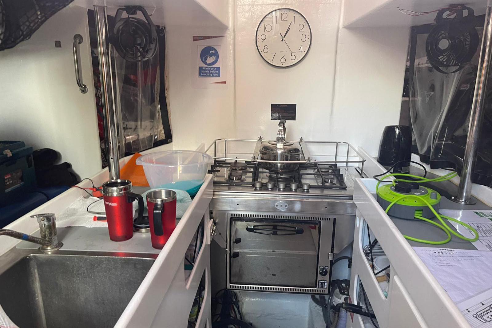 A view inside the kitchen of a racing yacht being used by Bob Brown.