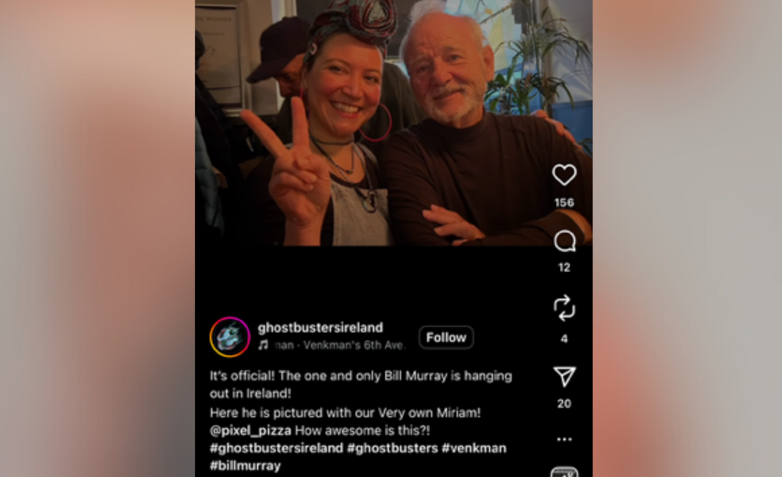 A woman does the peace sign with Bill Murray