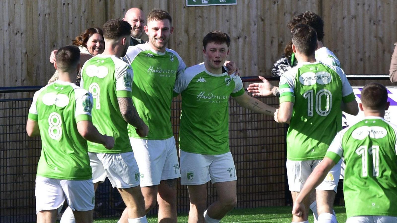 Guernsey FC players celebrate a goal