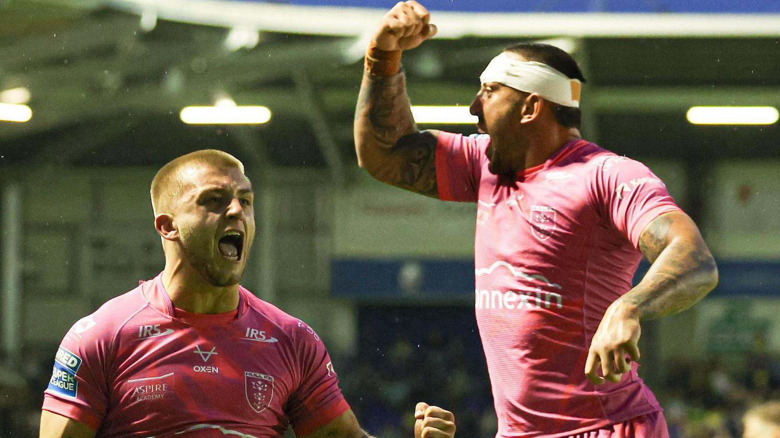 Mikey Lewis and Elliot Minchella celebrate for Hull KR by punching the air.