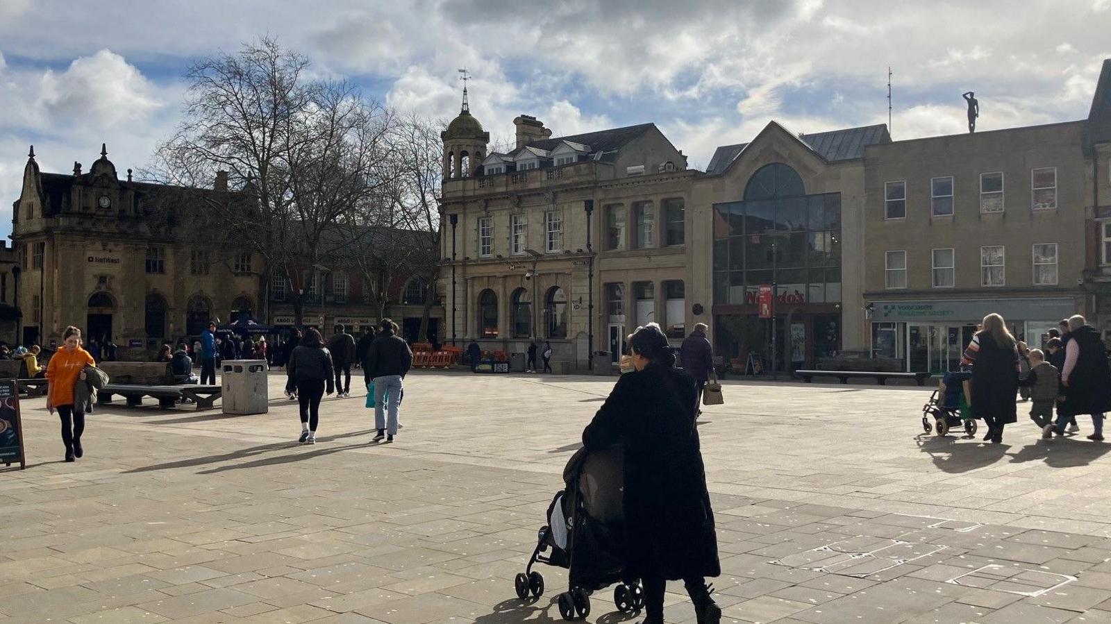 Cathedral Square- with people walking around the historic square 