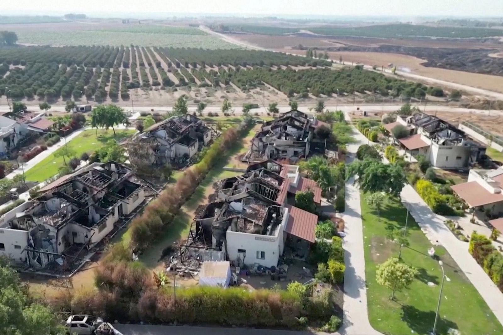 Drone footage of Kibbutz Be'eri following the 7 October attack. No roof is in intact - they are all burnt and charred.