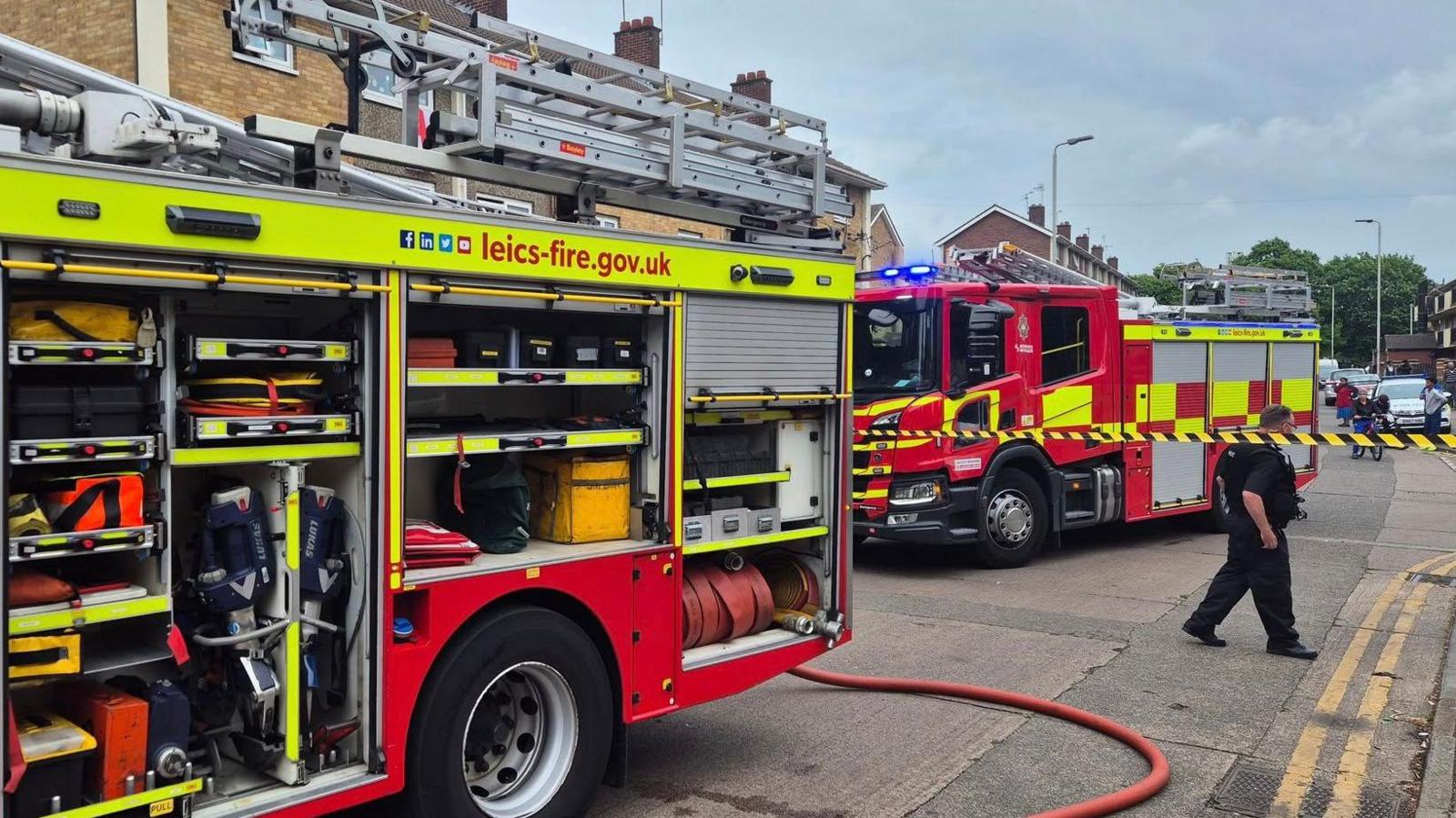 Firefighters and fire engines at the scene on Manitoba Road