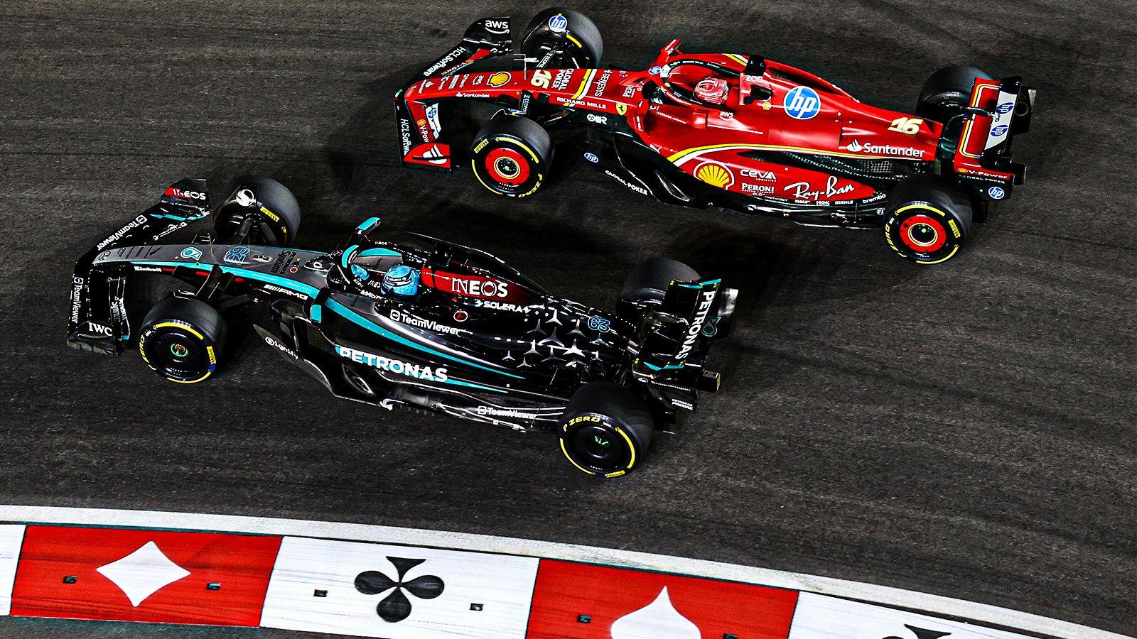 George Russell of Mercedes and Charles Leclerc of Ferarri battle for track position during the Las Vegas Grand Prix on 23 November in Nevada