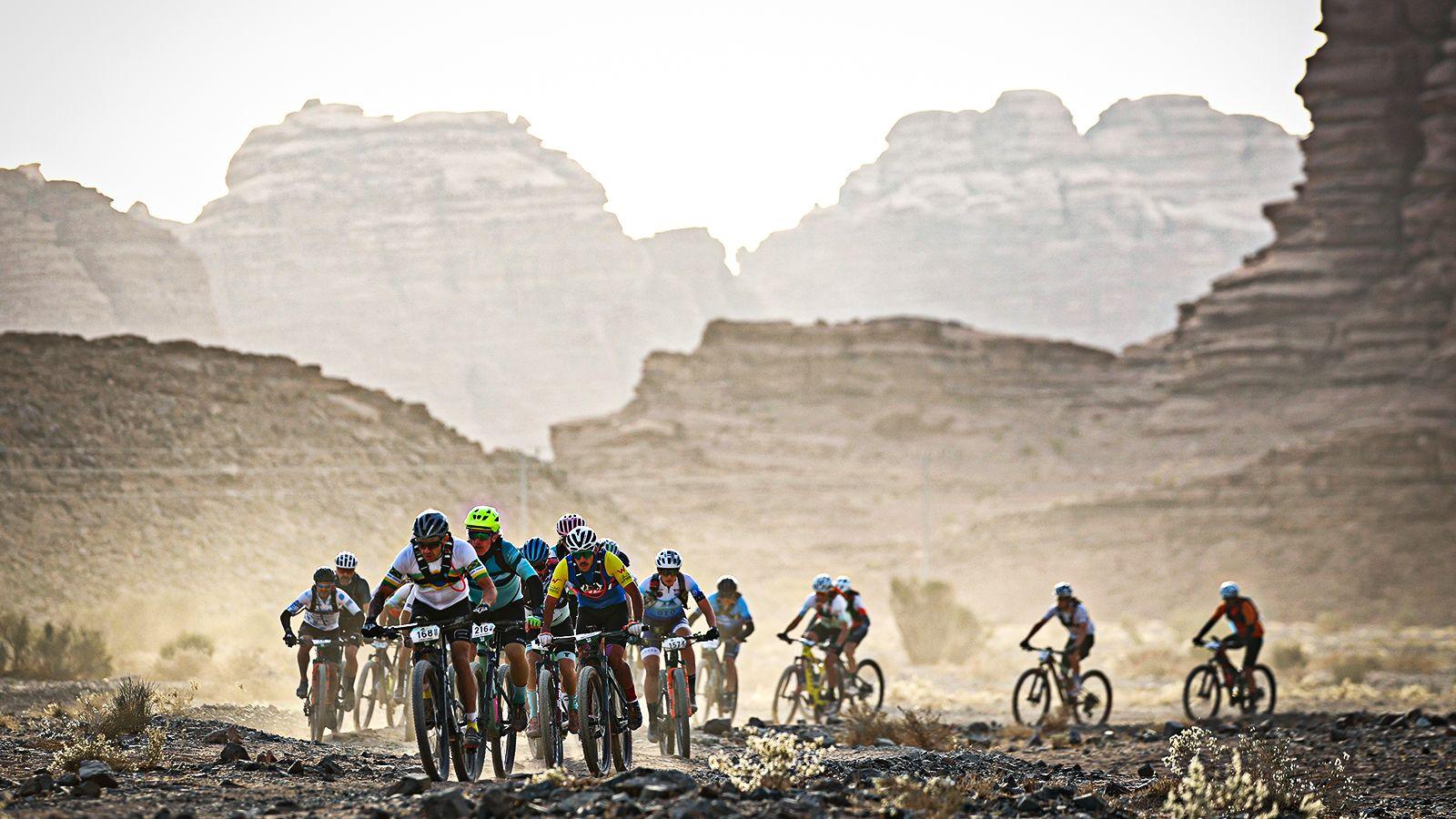 Athletes compete during stage three of the Neom Titan Desert on day 19 of the Neom Beach Games in Saudi Arabia, 21 Novembermber