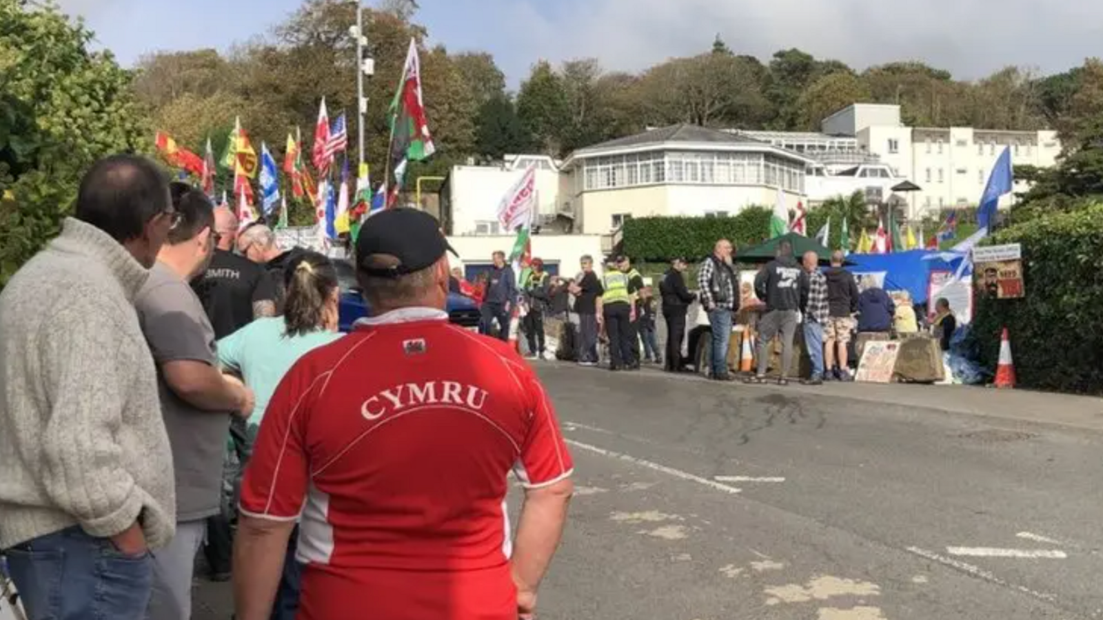 Protesters gather outside the Stradey Park Hotel in Llanelli when plans to use it for temporary housing for  asylum seekers was announced.