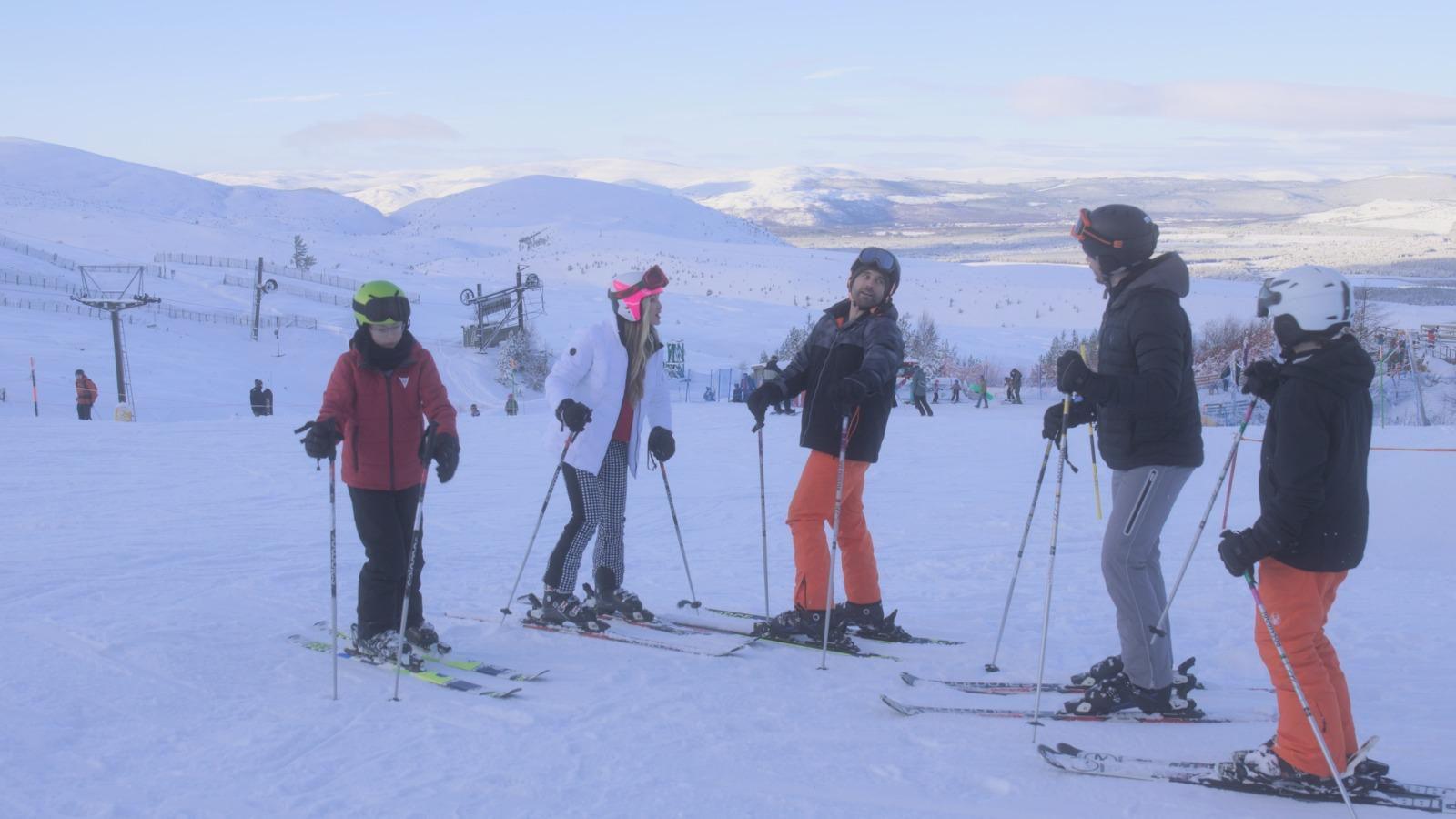 Actress Caprice and her co-stars are pictured in a scene from the movie on the slopes of Aviemore in skiing outfits.