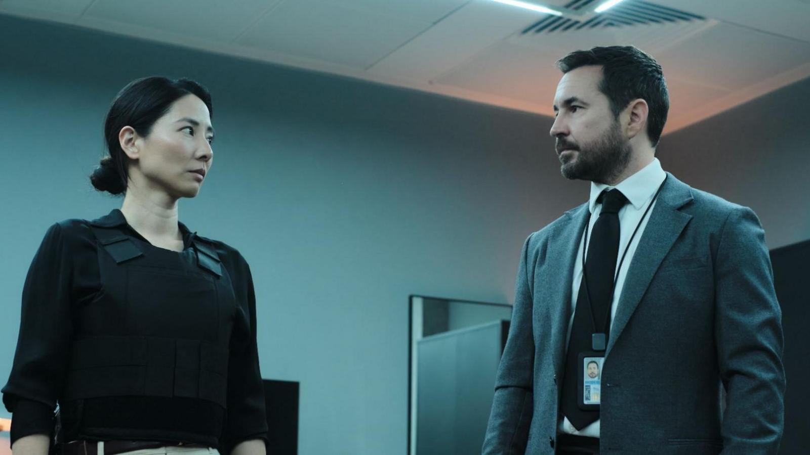 Jing Lusi and Martin Compston in character facing each other in series 2 of Red Eye
