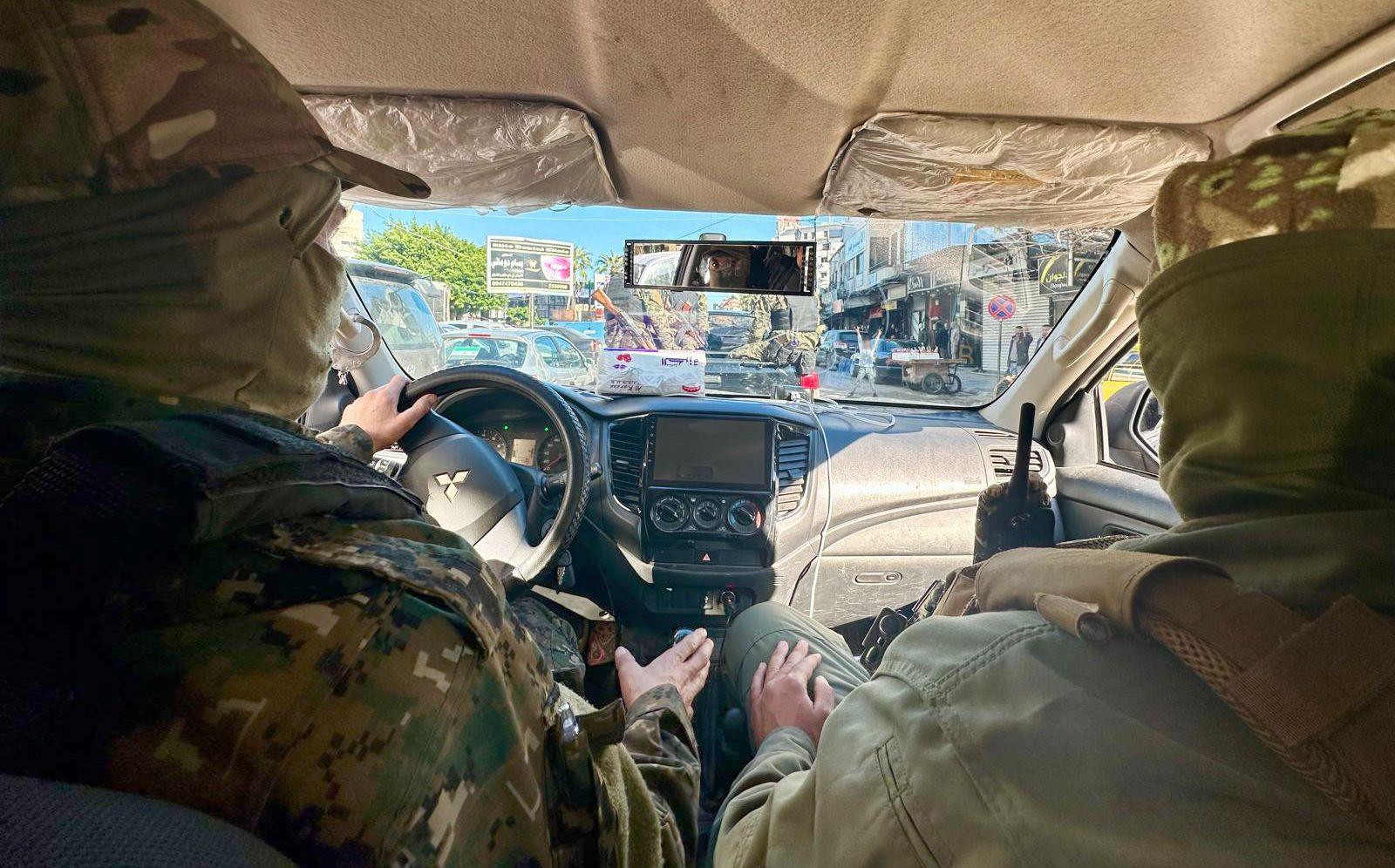 HTS drive through the busy streets of Latakia