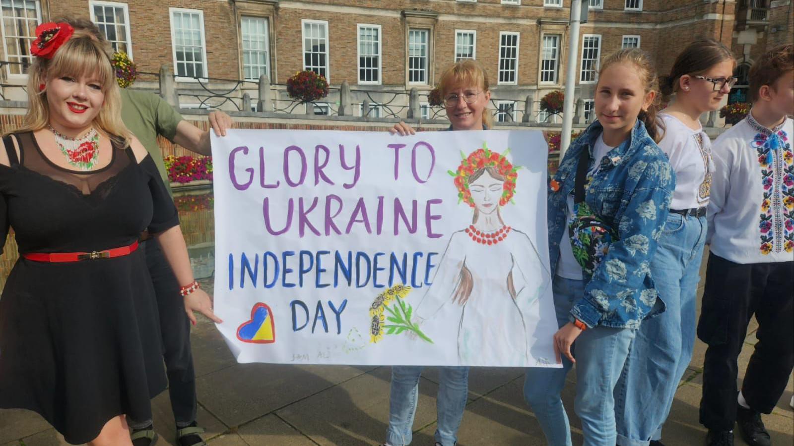 Two women holding a banner that says Glory to Ukraine Independence Day