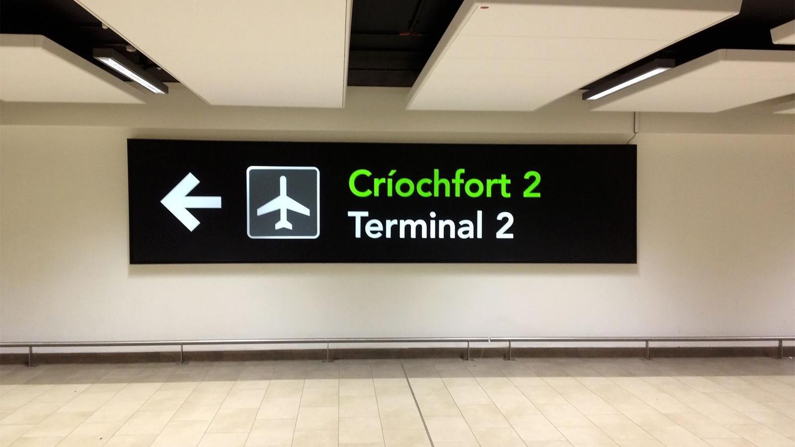 Terminal 2 sign at Dublin Airport in both English and Irish. 