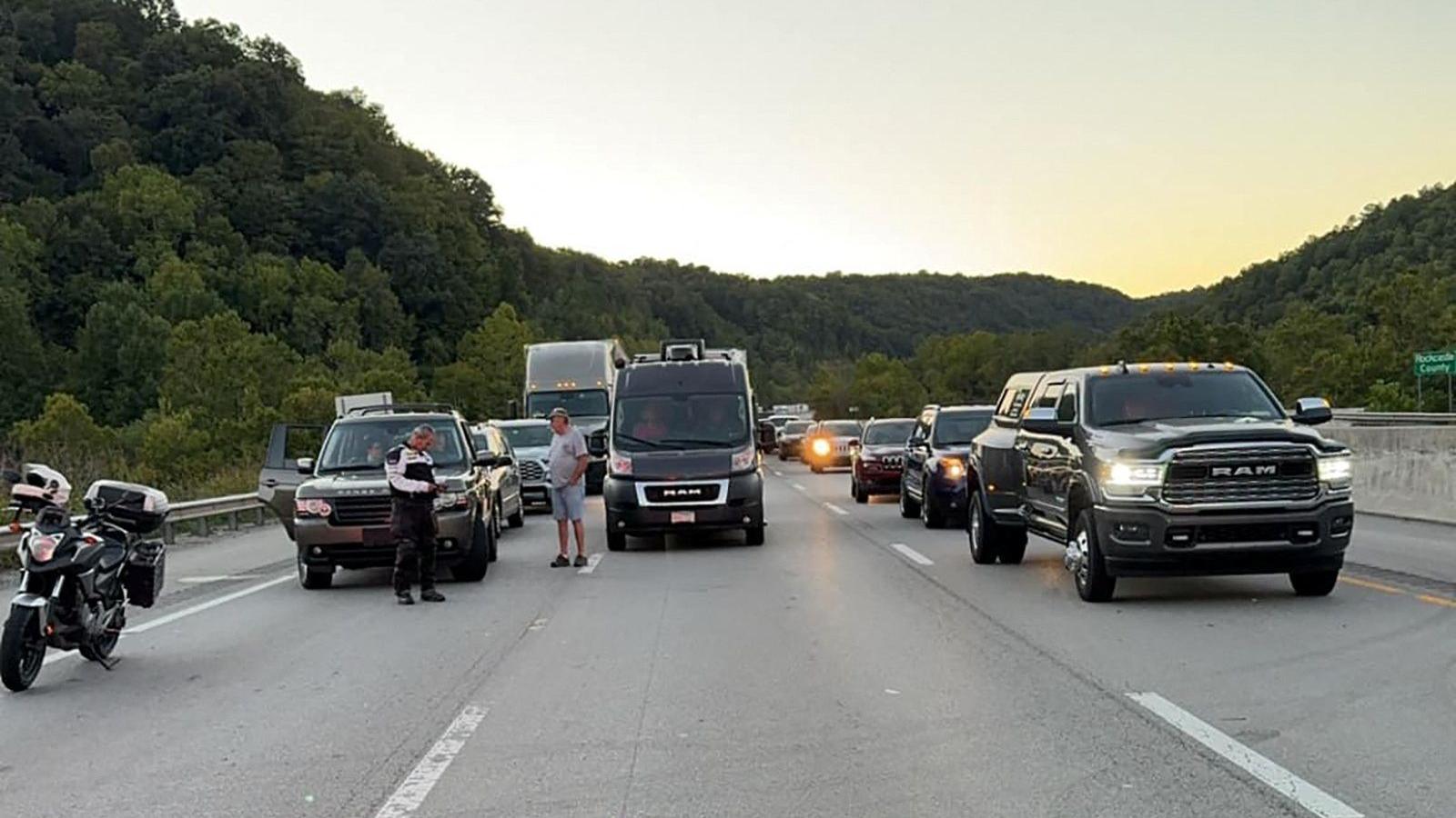 Drivers park on the lanes of the I-75 highway after multiple people were shot while driving 