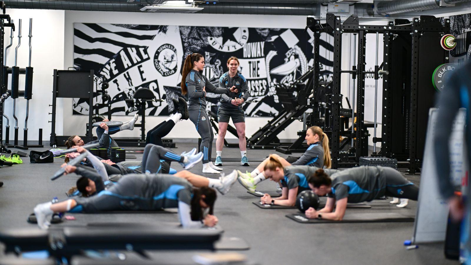 Newcastle training room showing players doing planks