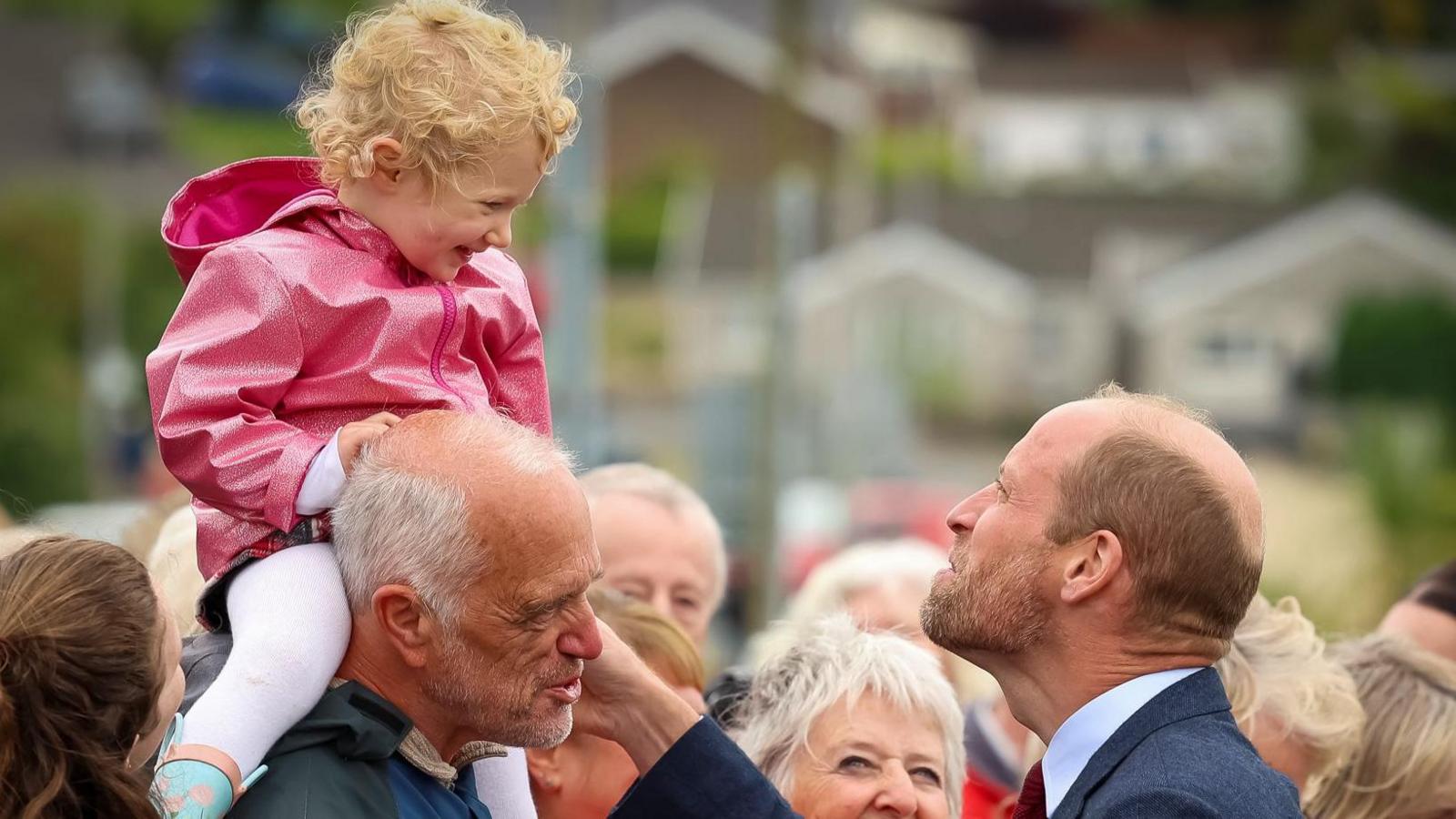 Britain's William, Prince of Wales, meets members of the public after visiting