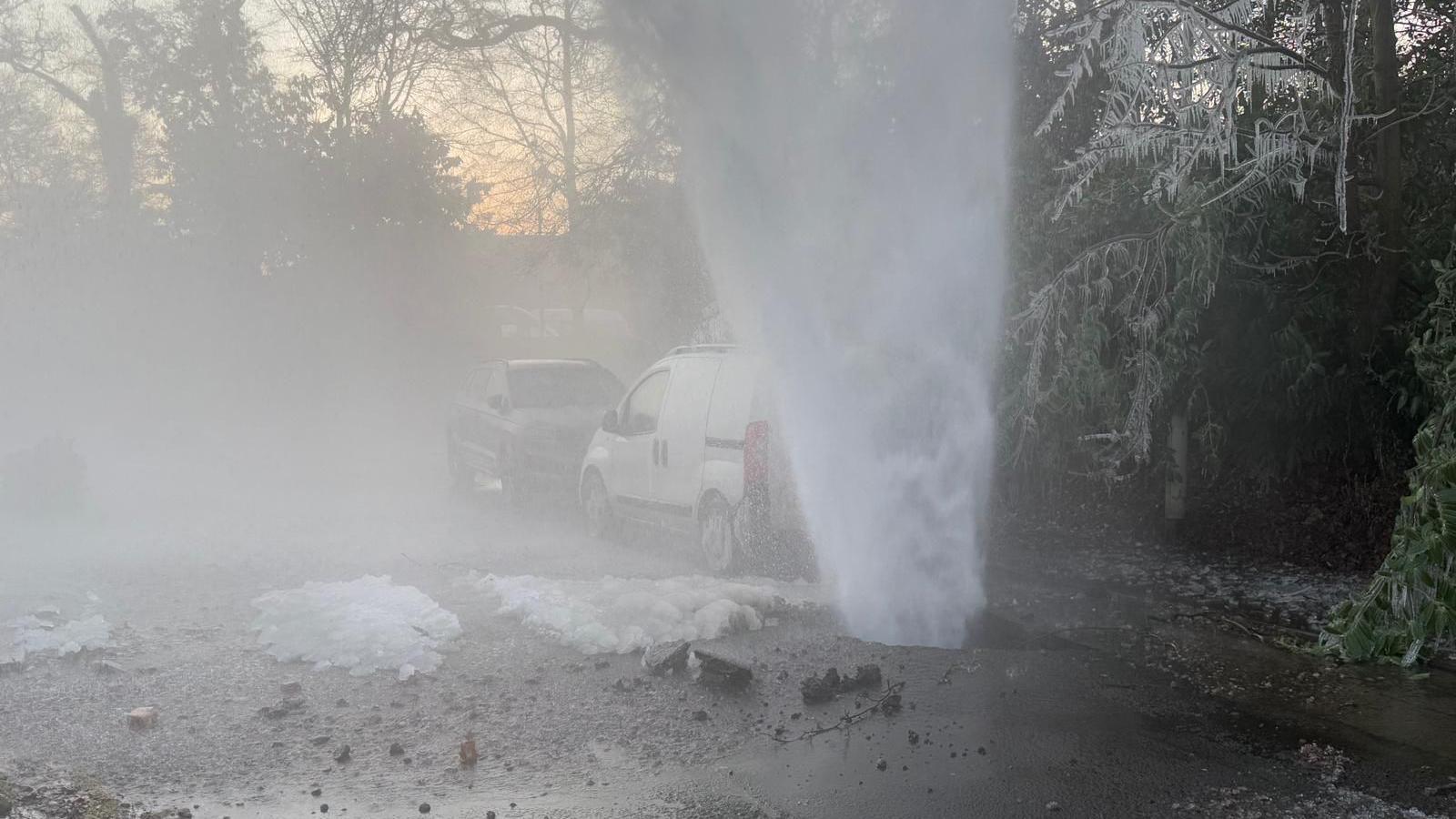 A burst water main spraying into the skies