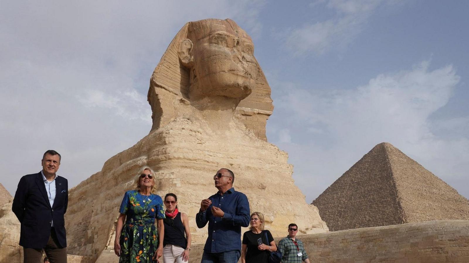 U.S. first lady Jill Biden speaks with head of Egypt's Supreme Council of Antiquities Mostafa Wazir during her visit to the historical site of Giza Pyramids 