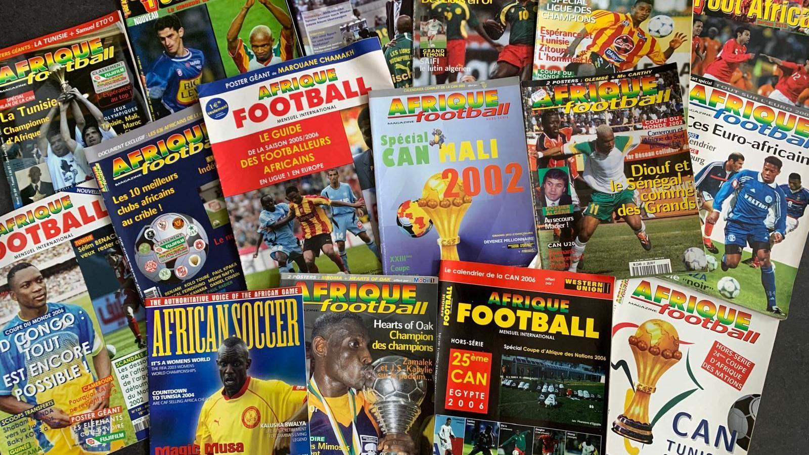 Numerous copies of Afrique Football magazine spread out on display