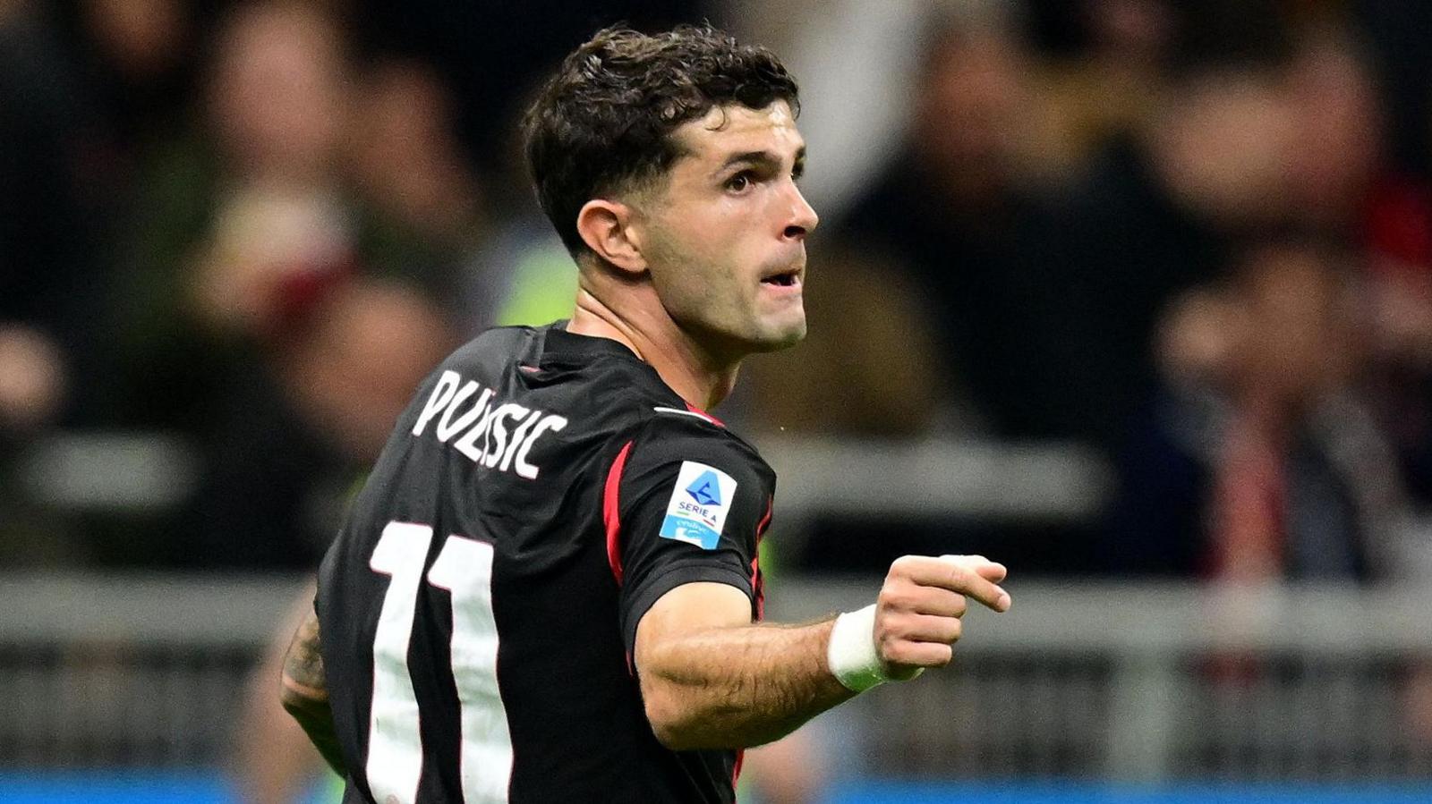 AC Milan forward Christian Pulisic celebrates scoring against Napoli