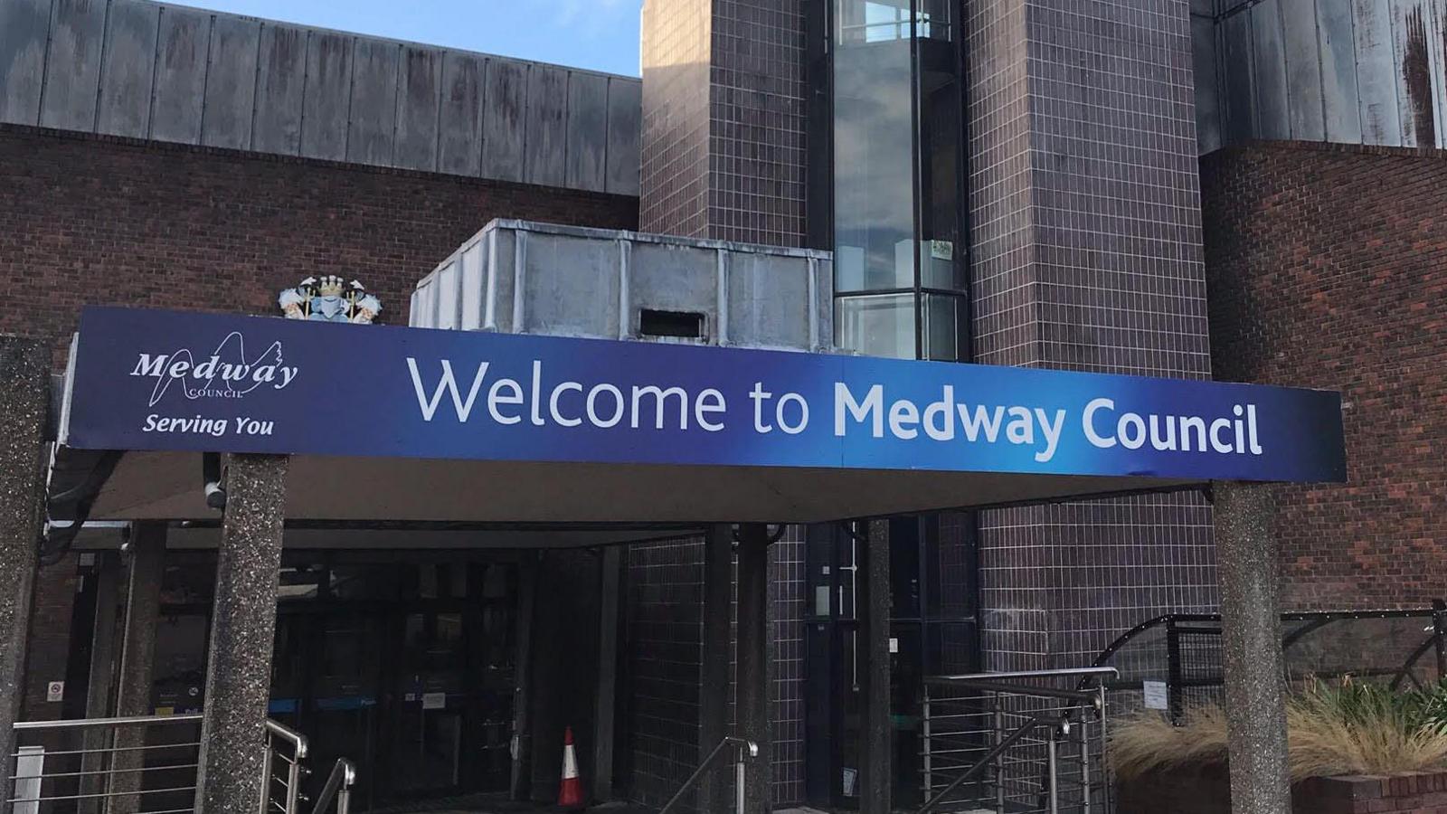 A sign outside a brick building reads welcome to Medway Council