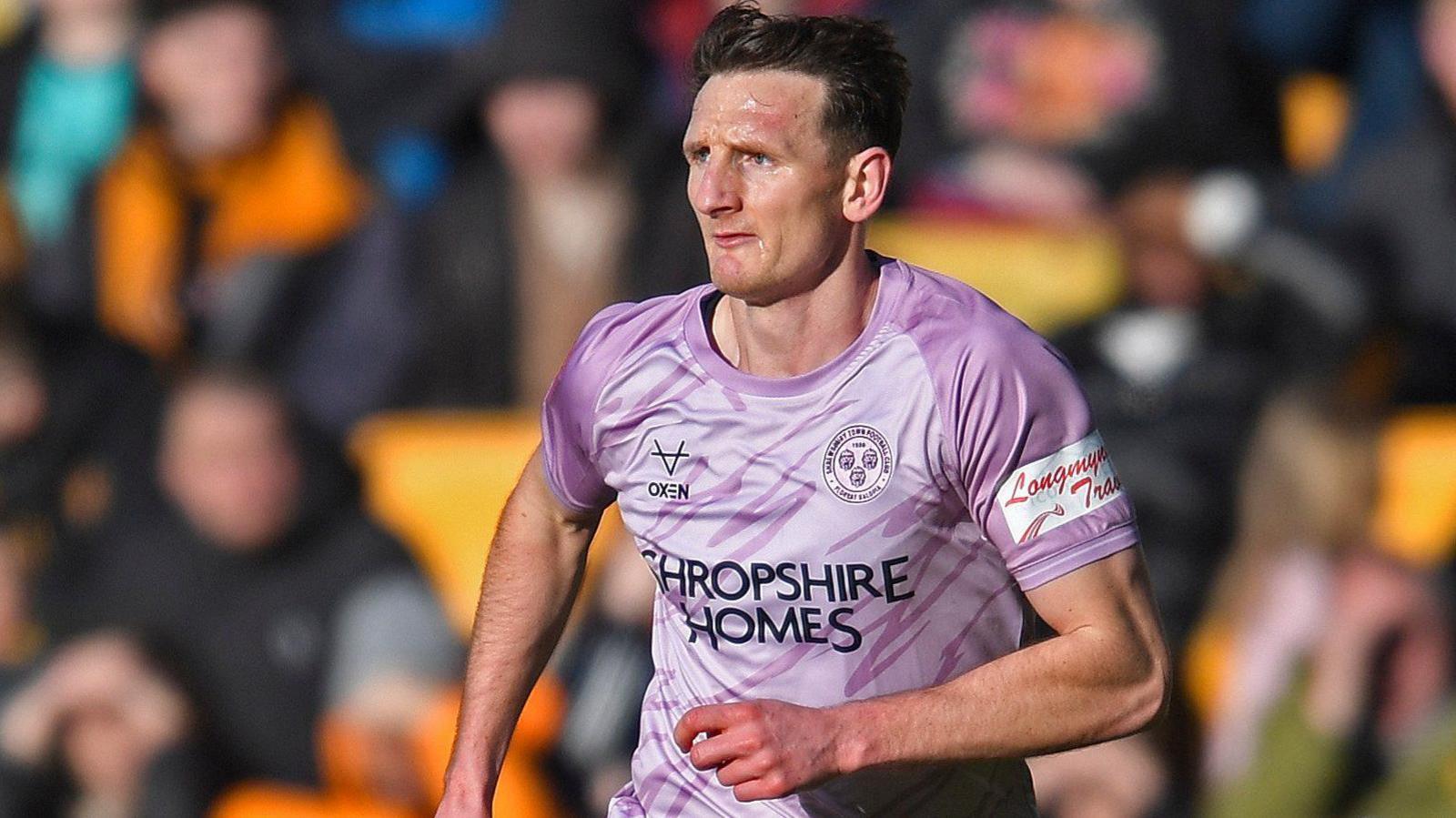 Shrewsbury Town captain Will Boyle in action during a match