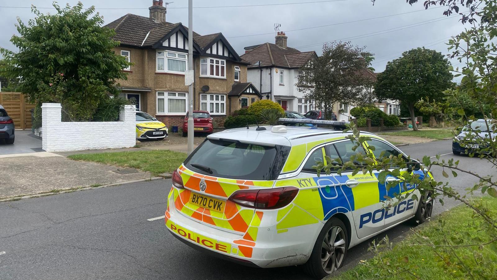 A police car on Raeburn Avenue