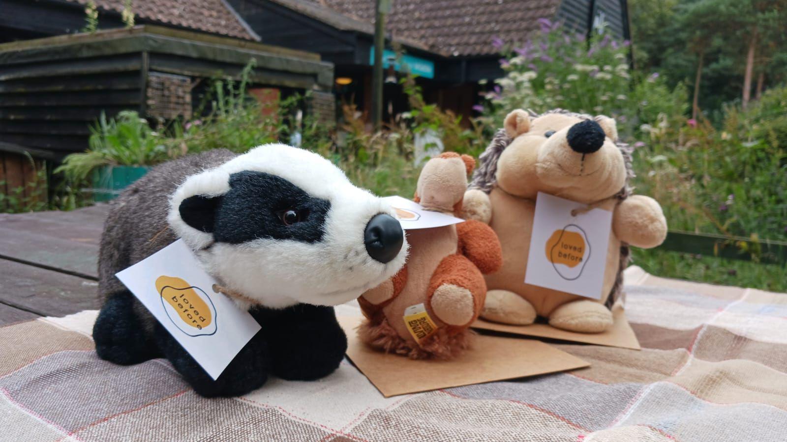 Three stuffed toys, including a badger