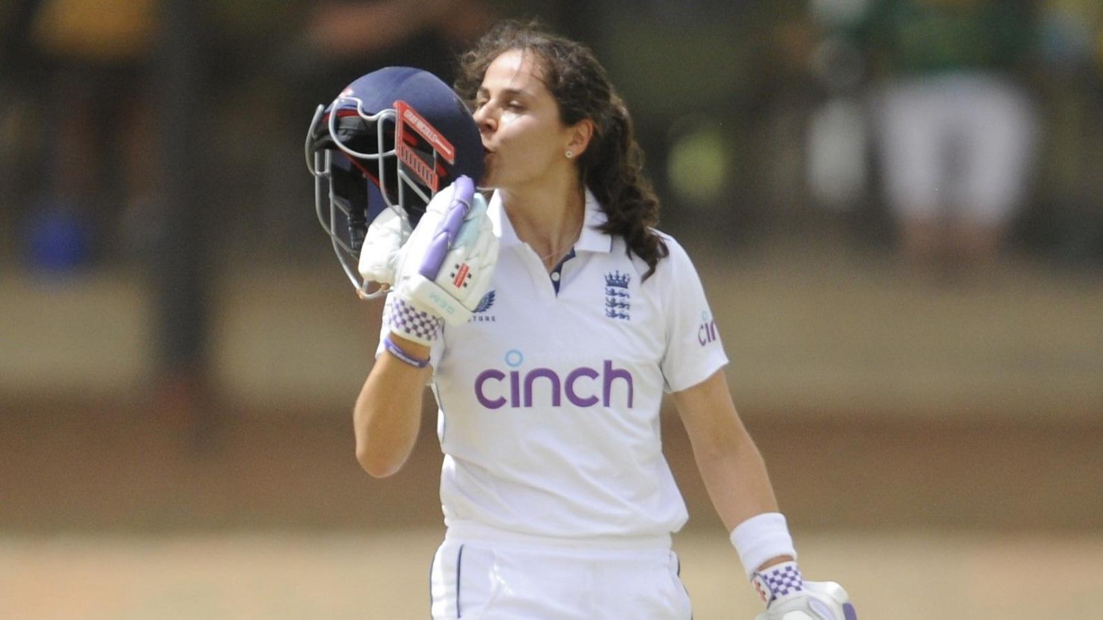 England's Maia Bouchier kisses the badge on her helmet after reaching a century on her Test debut against South Africa