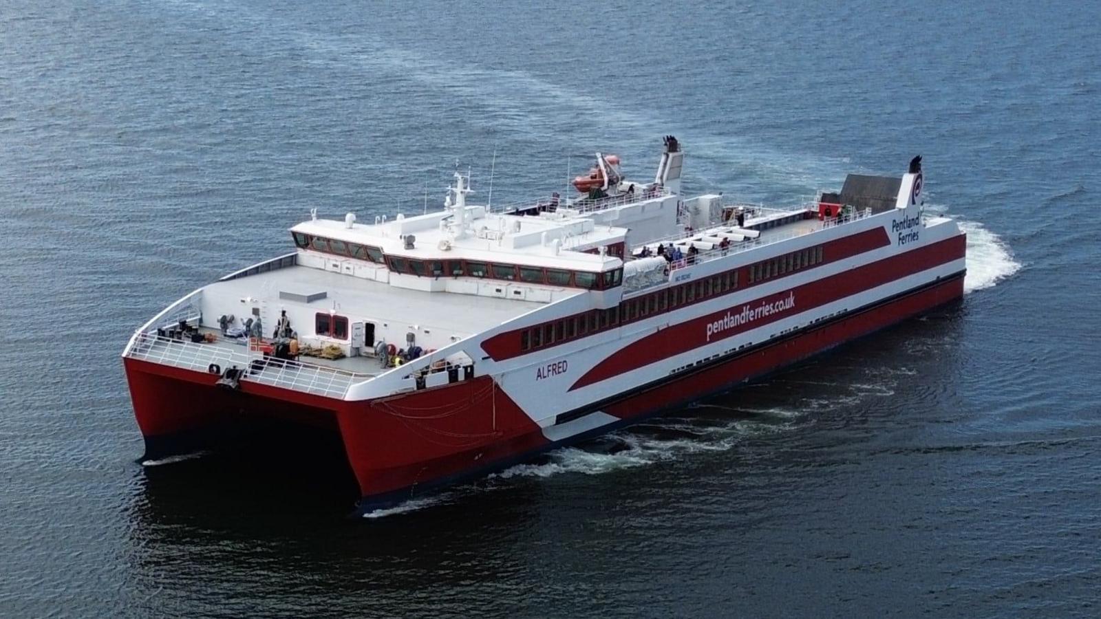 A red and white catamaran