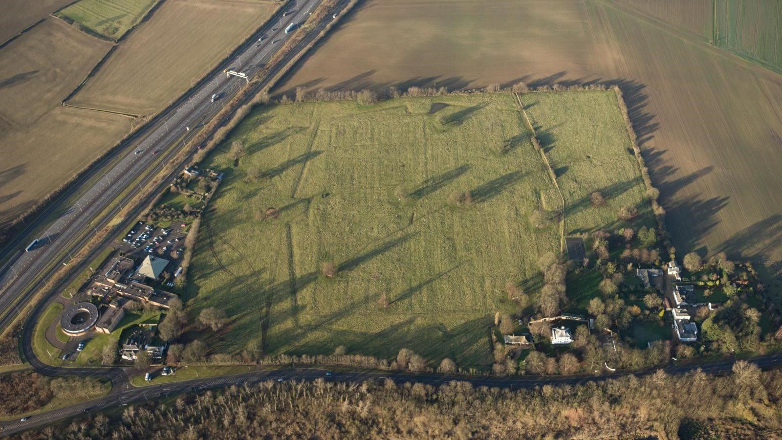 A drone image of the green space where the site is located.