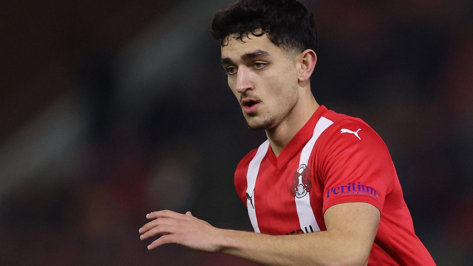 Sonny Perkins in action for Leyton Orient in the club's red home strip