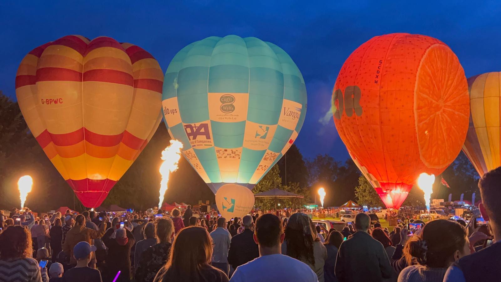 Hot air balloons on the floor at night