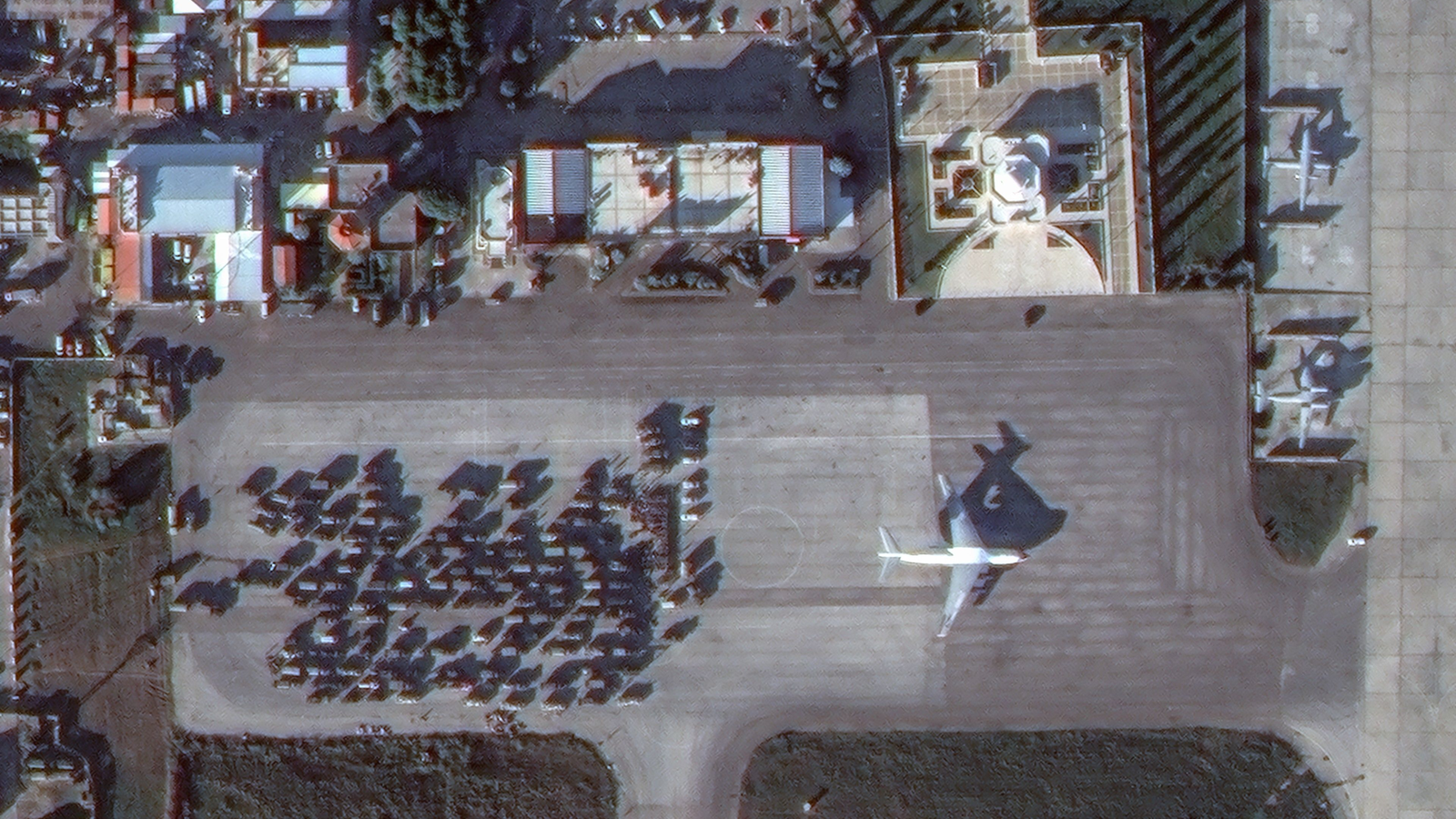 Dozens of military vehicles at the airfield near a Russian-made Ilyushin Il-76 military transport plane on 15 December, captured by Maxar Technologies