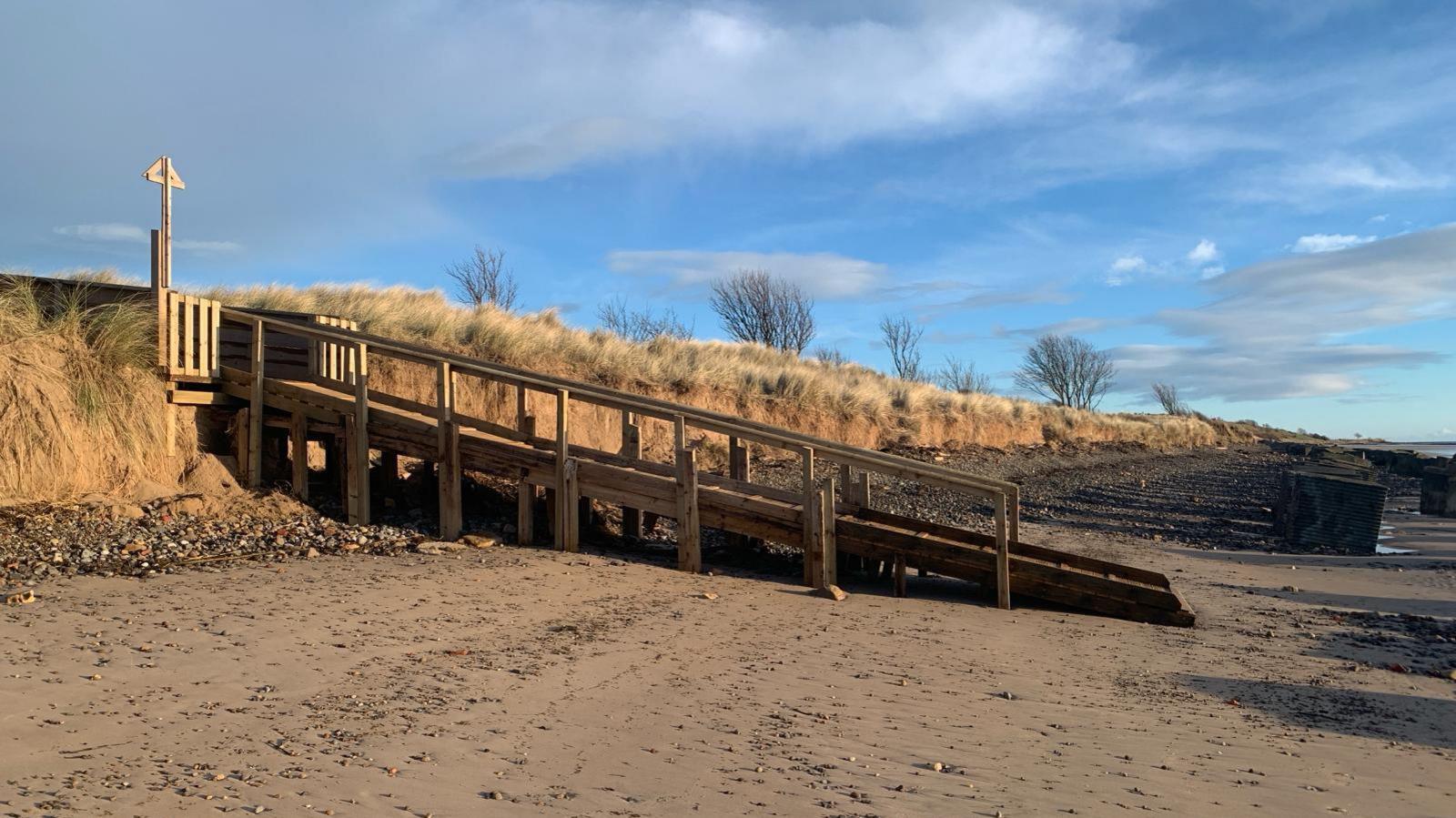 A new walkway onto a beach 