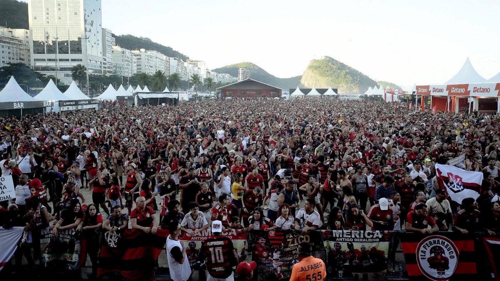 Fans watch on Copacabana beach