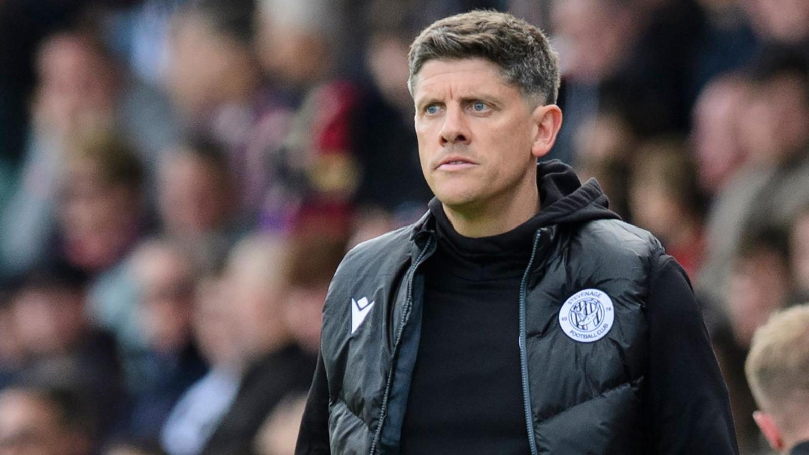 Stevenage boss Alex Revell watching his team from the touchline