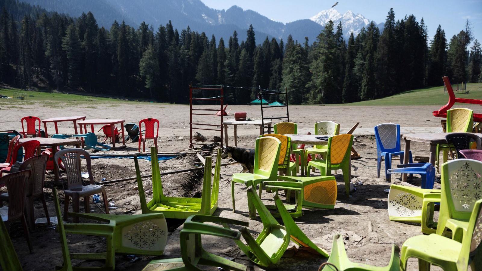 Chairs and tables are scattered at the site of a suspected militant attack on tourists in Baisaran near Pahalgam in south Kashmir's Anantnag district, April 24, 2025. REUTERS/Adnan Abidi