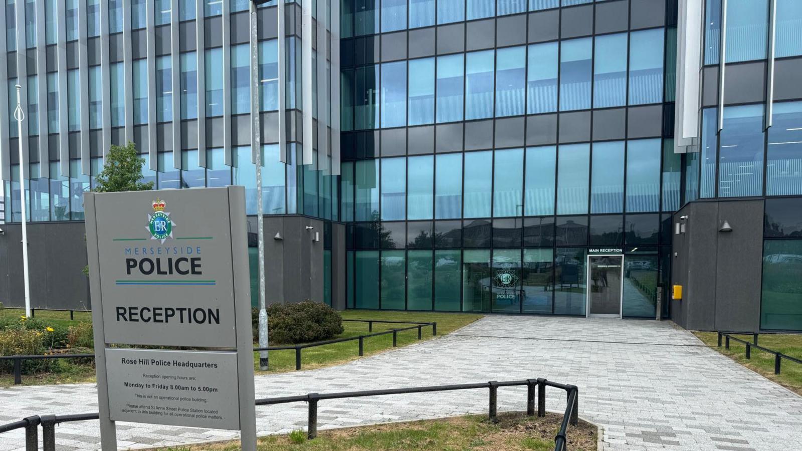 Merseyside Police HQ with sign outside its all glass offices
